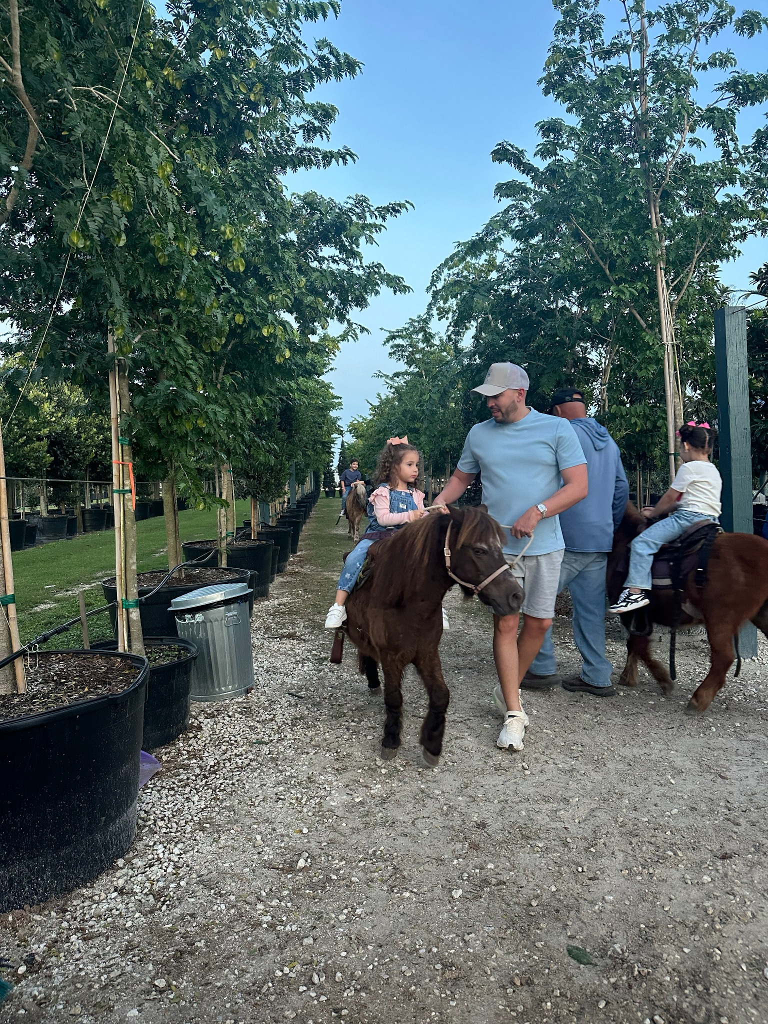 Kids enjoying Fun Games pony rides at a birthday party in Miami